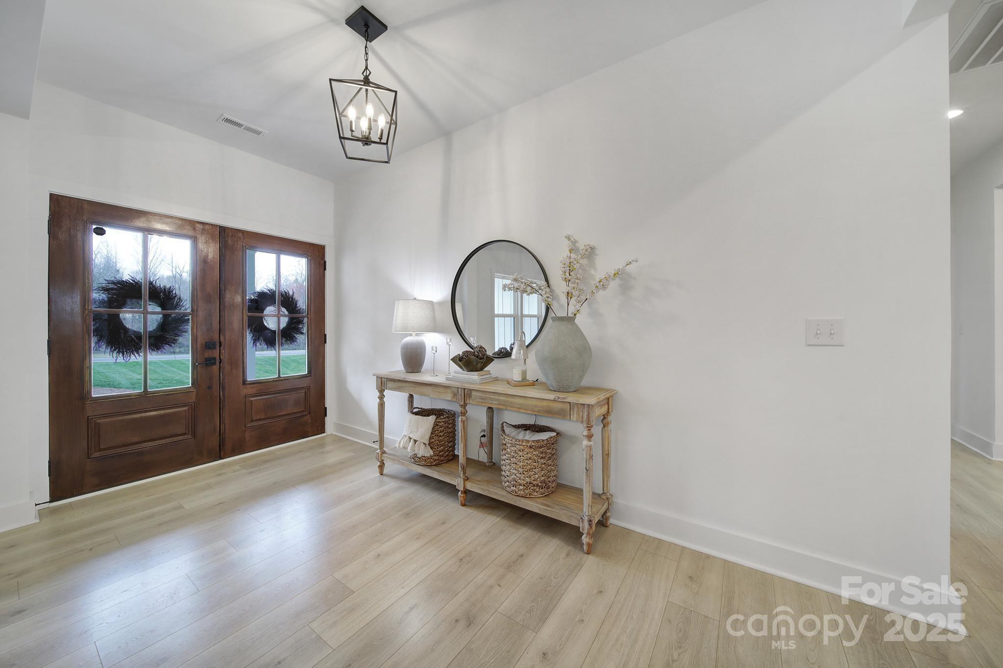 856 Bellegray Road Clover, SC 29710 - Photo 3 of 48 a view of a room with wooden floor fan and windows