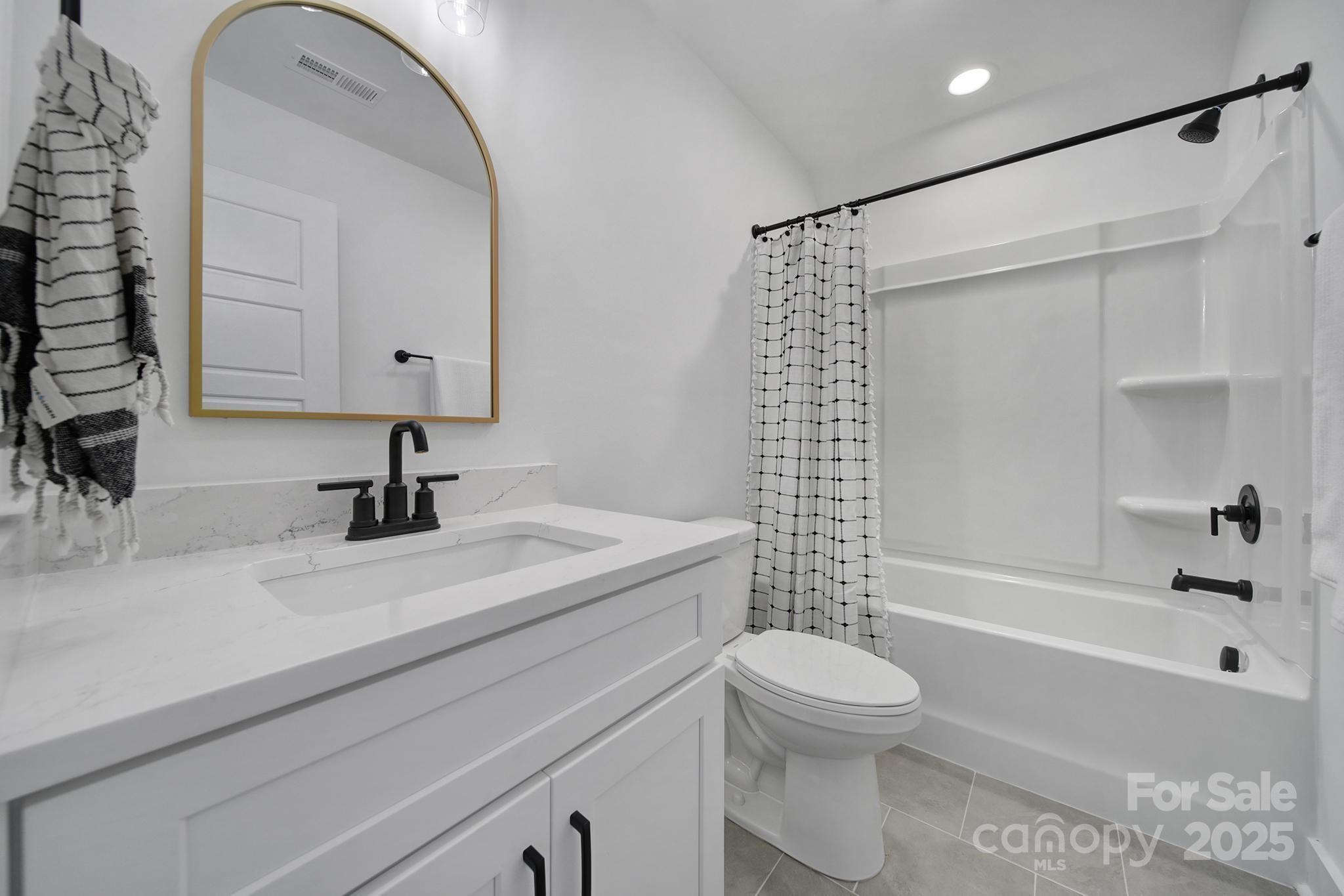 856 Bellegray Road Clover, SC 29710 - Photo 36 of 48 a bathroom with a sink a toilet and a bathtub