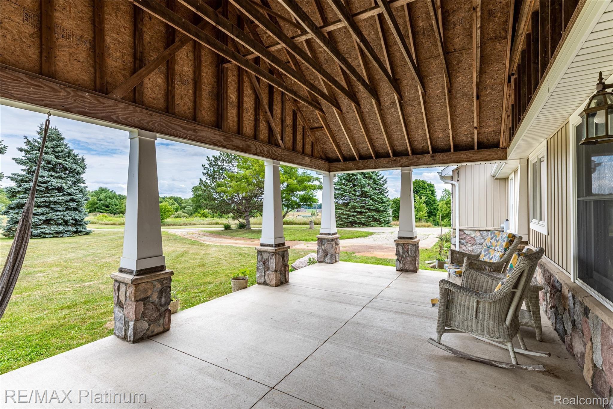 593 North Hacker Road Howell, MI 48843 - Photo 38 of 48 The perfect porch for coffee and sunrises!