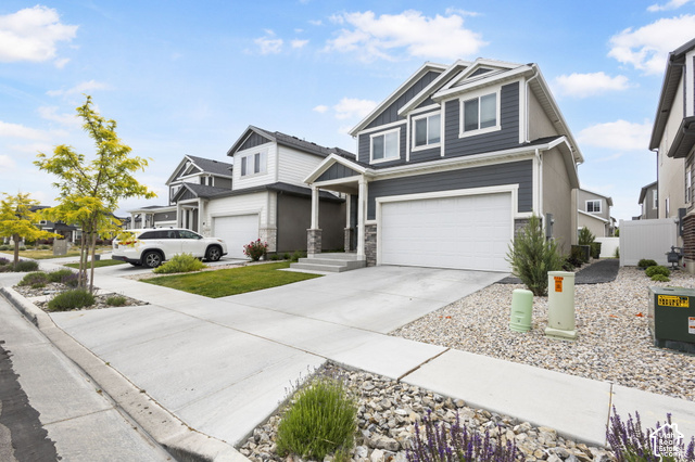7723 Conger Road Magna, UT 84044 - Photo 21 of 24 Contemporary two-story exterior with dark gray siding accents and white trim