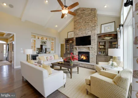 a living room with furniture fireplace and a flat screen tv