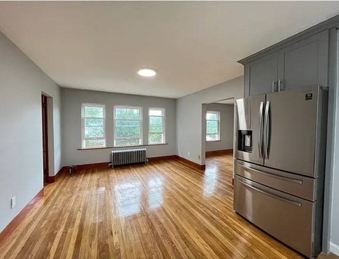 663 Union Street Braintree, MA 02184 - Photo 4 of 9 a view of a kitchen with wooden floor refrigerator and window