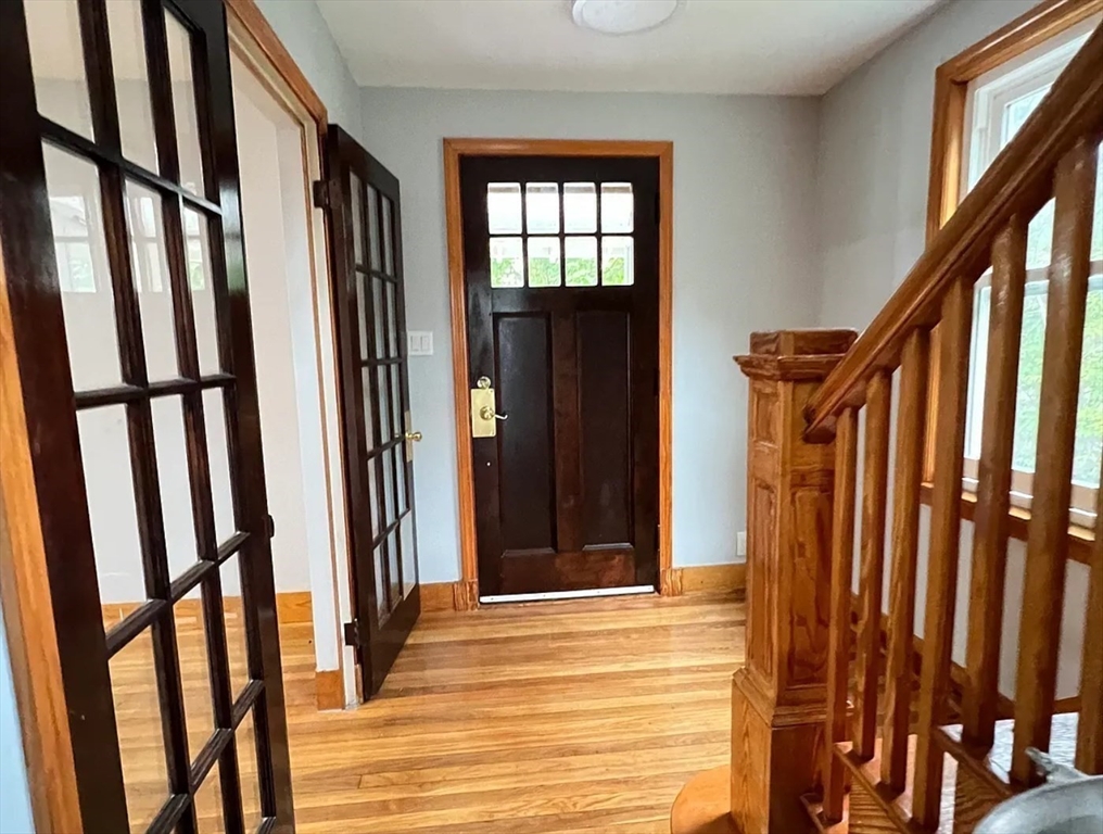 663 Union Street Braintree, MA 02184 - Photo 5 of 9 a view of a balcony with wooden floor and stairs