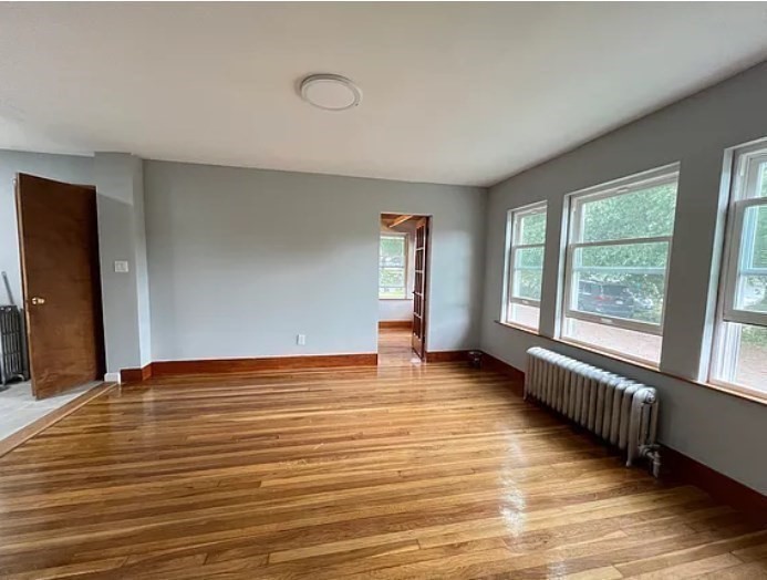 663 Union Street Braintree, MA 02184 - Photo 6 of 9 a view of an empty room with glass door and windows
