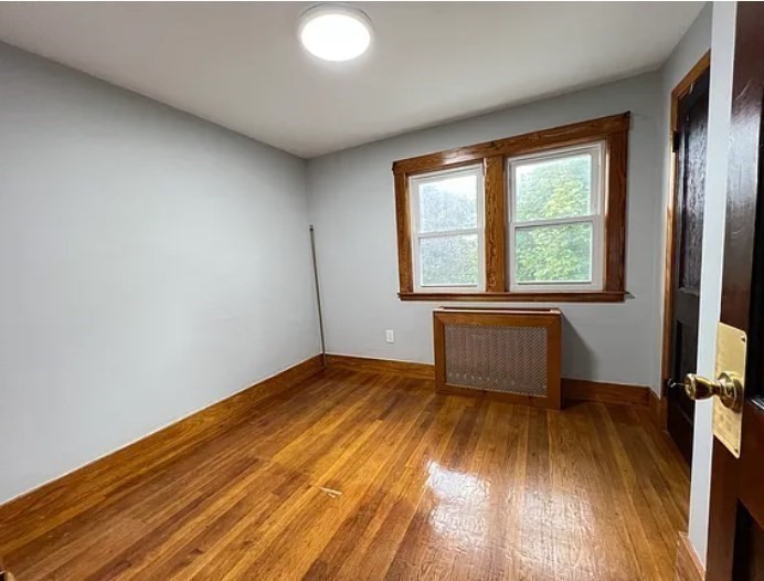 663 Union Street Braintree, MA 02184 - Photo 7 of 9 an empty room with wooden floor and windows