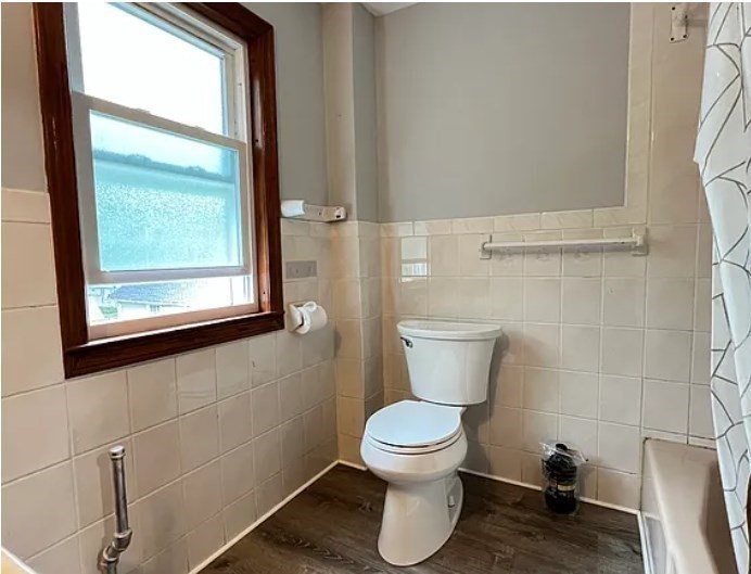 663 Union Street Braintree, MA 02184 - Photo 8 of 9 a white toilet sitting next to a bathroom sink