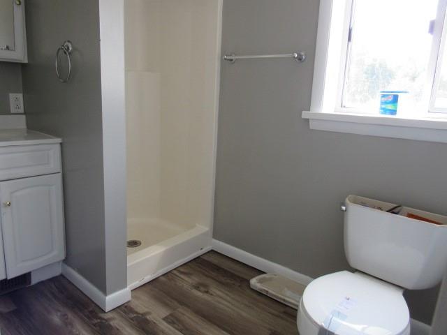 123 2nd Street Normalville, PA 15469 - Photo 13 of 26 a white toilet sitting next to a bathroom sink