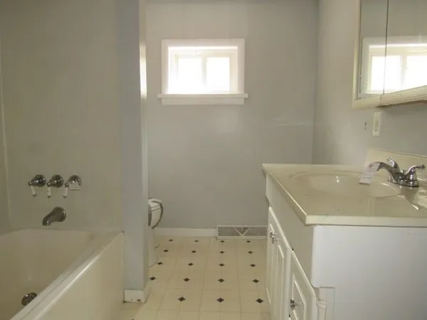 a bathroom with a sink a bathtub and a shower