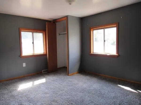an empty room with windows