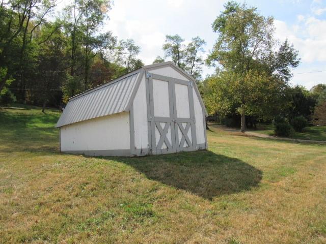 123 2nd Street Normalville, PA 15469 - Photo 6 of 26 a view of a wooden house with a yard