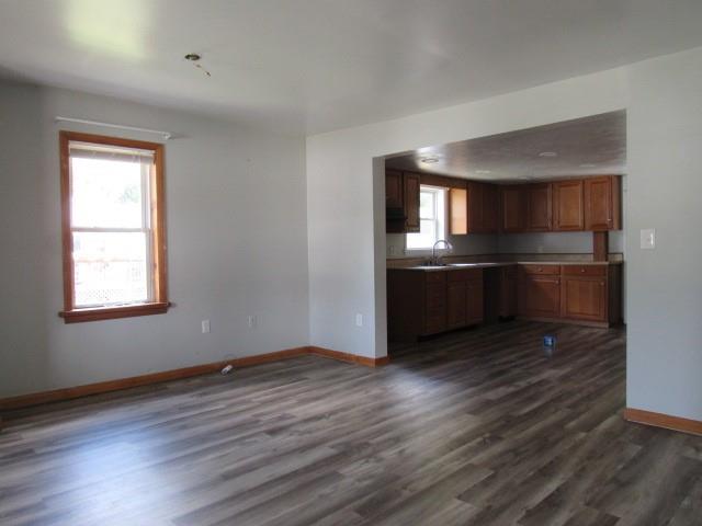 123 2nd Street Normalville, PA 15469 - Photo 7 of 26 an empty room with wooden floor and windows
