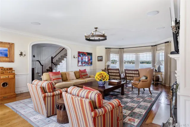 a living room with furniture fireplace and flat screen tv