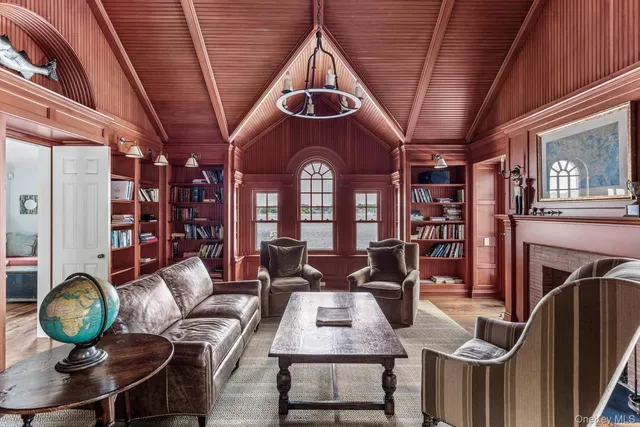 a bedroom with a bed window and a chair