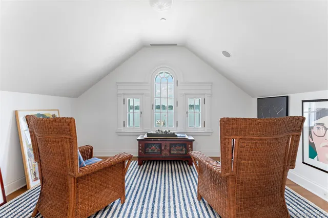 a view of river and trees in the background