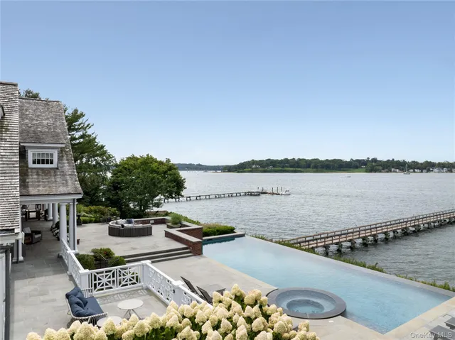 a view of a lake with couches and city view