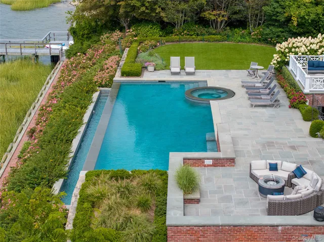a view of a swimming pool with a patio