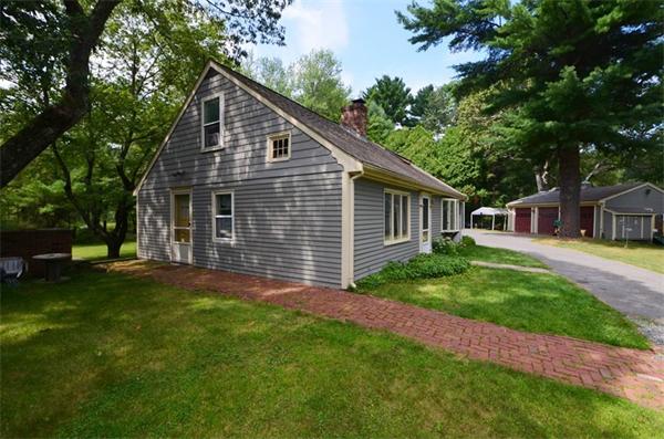 63 Concord Road Wayland, MA 01778 - Photo 1 of 30 a front view of house with yard and green space
