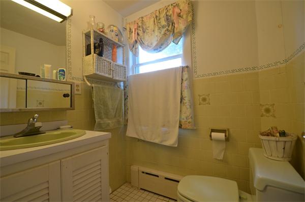 63 Concord Road Wayland, MA 01778 - Photo 14 of 30 a bathroom with a sink toilet and shower