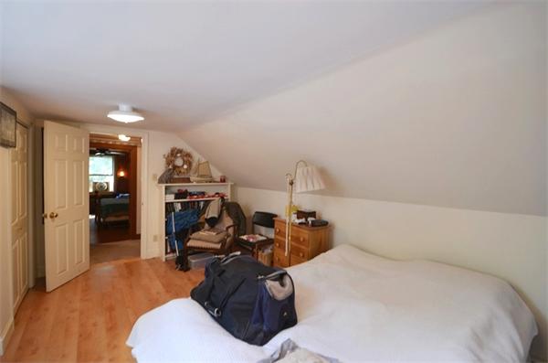 63 Concord Road Wayland, MA 01778 - Photo 17 of 30 a bed room with a bed furniture and a view of bedroom