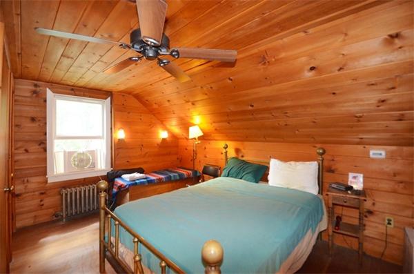63 Concord Road Wayland, MA 01778 - Photo 19 of 30 a bedroom with a bed and a window