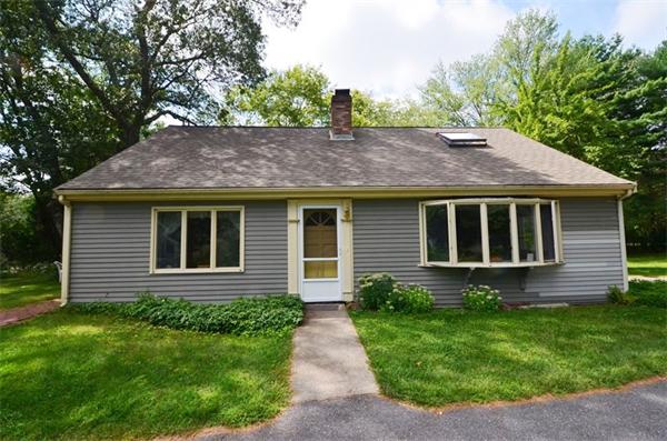 63 Concord Road Wayland, MA 01778 - Photo 2 of 30 a front view of a house with garden