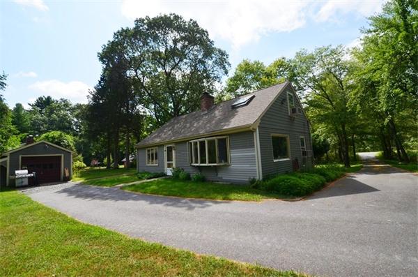 63 Concord Road Wayland, MA 01778 - Photo 21 of 30 a front view of a house with garden