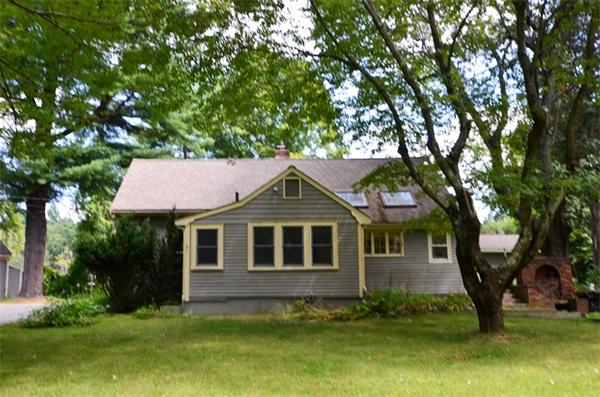 63 Concord Road Wayland, MA 01778 - Photo 22 of 30 a front view of a house with a garden