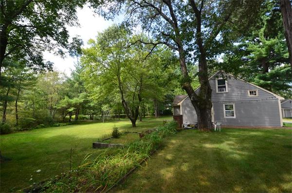 63 Concord Road Wayland, MA 01778 - Photo 24 of 30 a view of a backyard with large trees