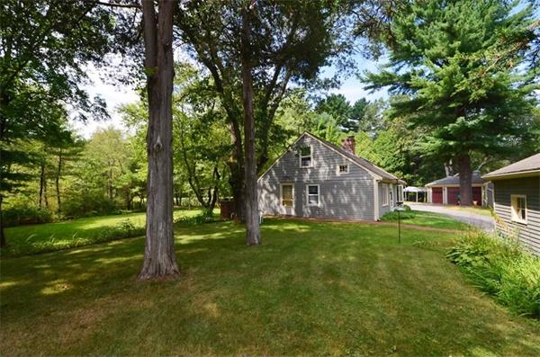 63 Concord Road Wayland, MA 01778 - Photo 25 of 30 a yellow house in middle of the forest