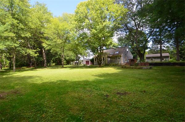 63 Concord Road Wayland, MA 01778 - Photo 29 of 30 a view of a tree in front of a house