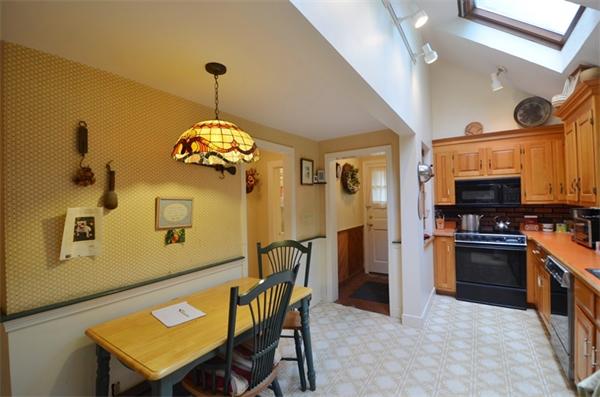 63 Concord Road Wayland, MA 01778 - Photo 6 of 30 a dining room with stainless steel appliances granite countertop furniture and a chandelier