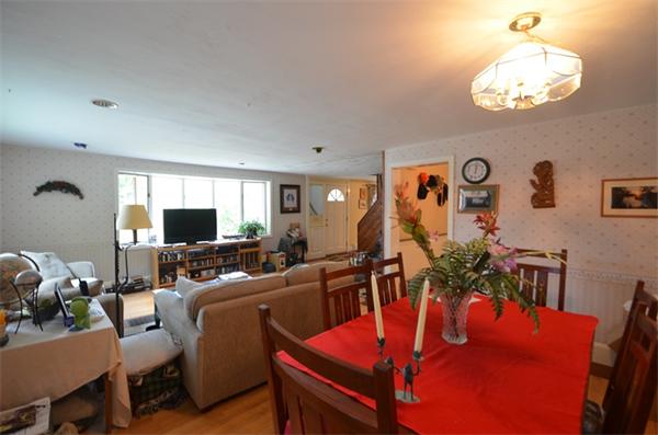 63 Concord Road Wayland, MA 01778 - Photo 9 of 30 a living room with furniture kitchen view and a large mirror