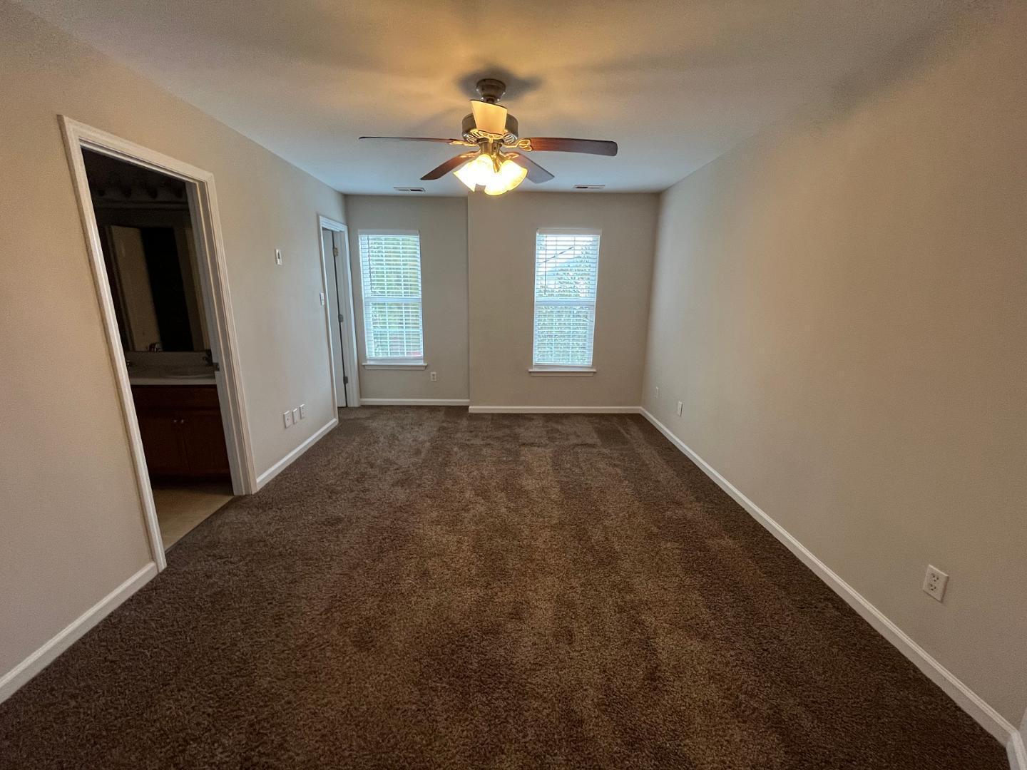 5104 Thornton Knoll Way Raleigh, NC 27616 - Photo 17 of 21 an empty room with windows and entrance