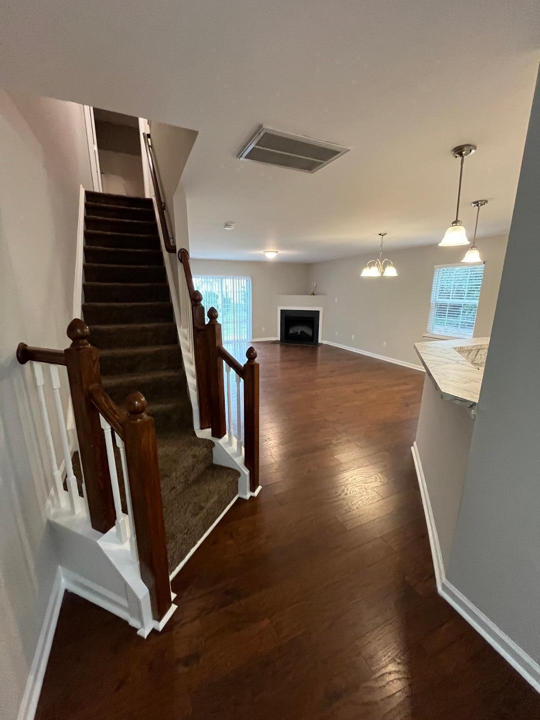 5104 Thornton Knoll Way Raleigh, NC 27616 - Photo 9 of 21 a view of an entryway with wooden floor