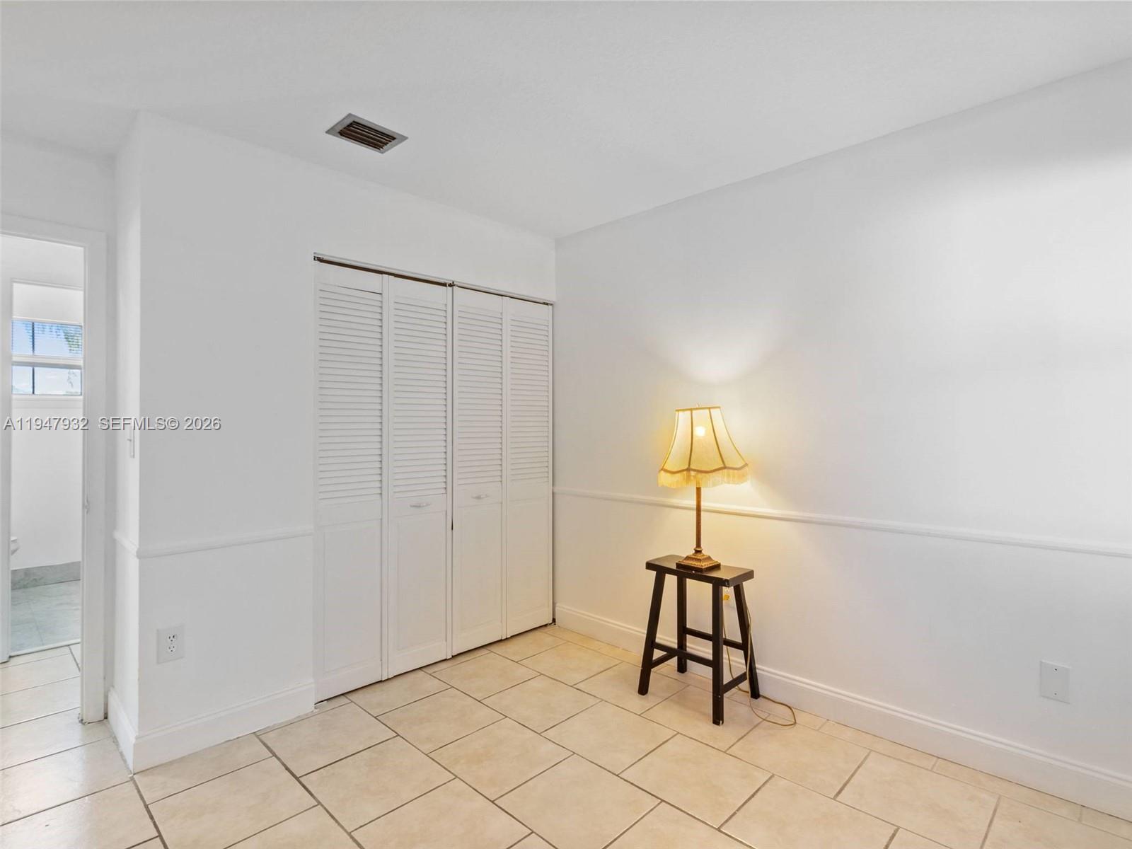 9066 Southwest 147th Court Miami, FL 33196 - Photo 20 of 31 a room with a table and a window