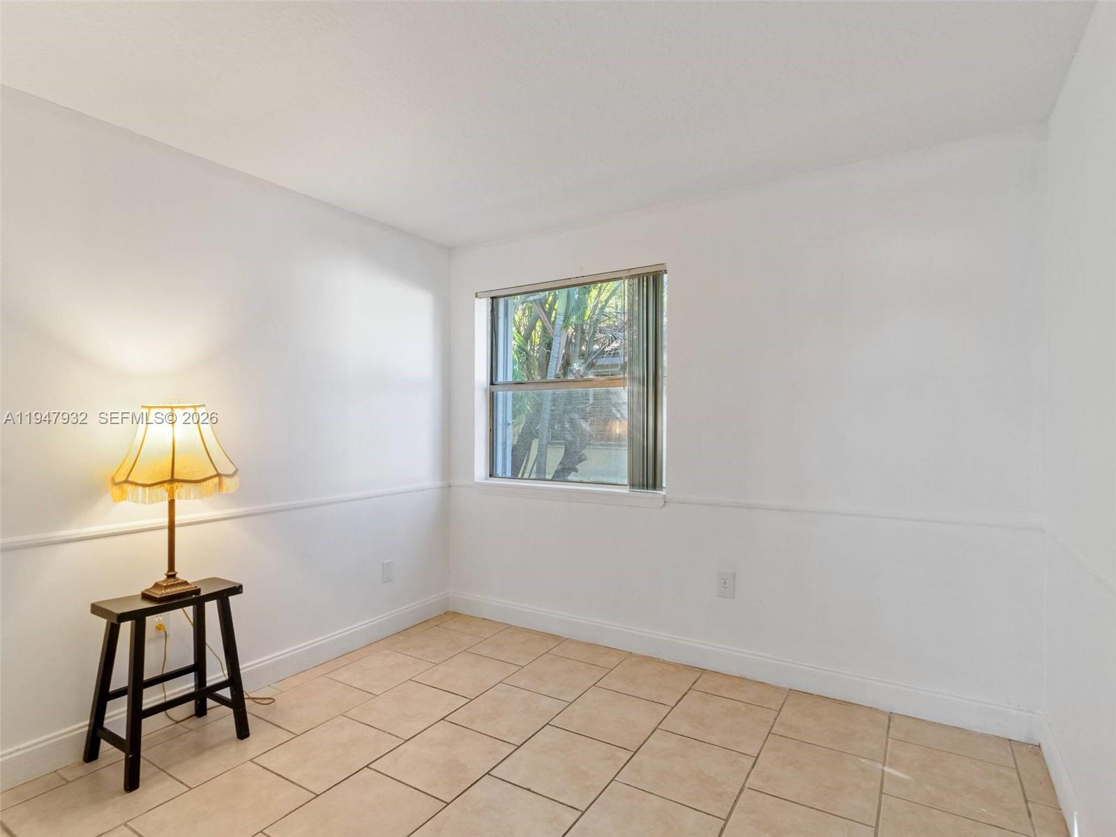 9066 Southwest 147th Court Miami, FL 33196 - Photo 21 of 31 a view of an empty room with window