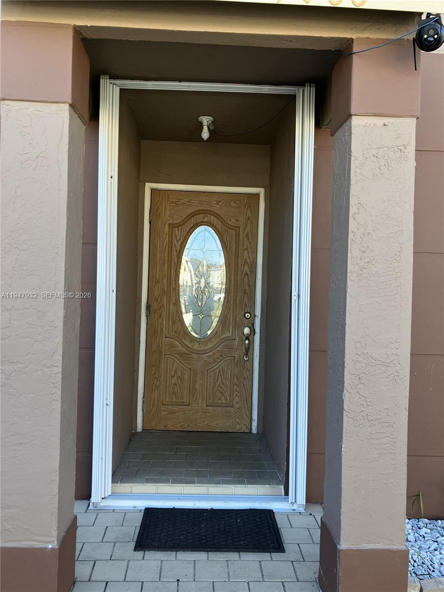 9066 Southwest 147th Court Miami, FL 33196 - Photo 4 of 31 a view of a door with a wooden door