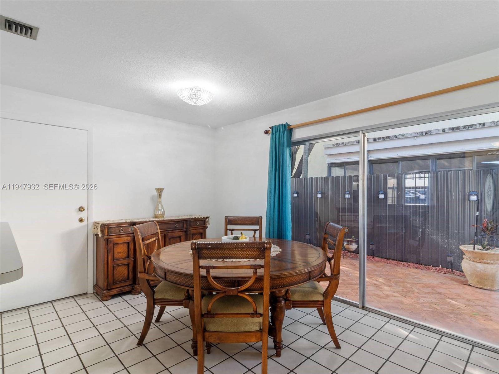 9066 Southwest 147th Court Miami, FL 33196 - Photo 9 of 31 a view of a dining room with furniture