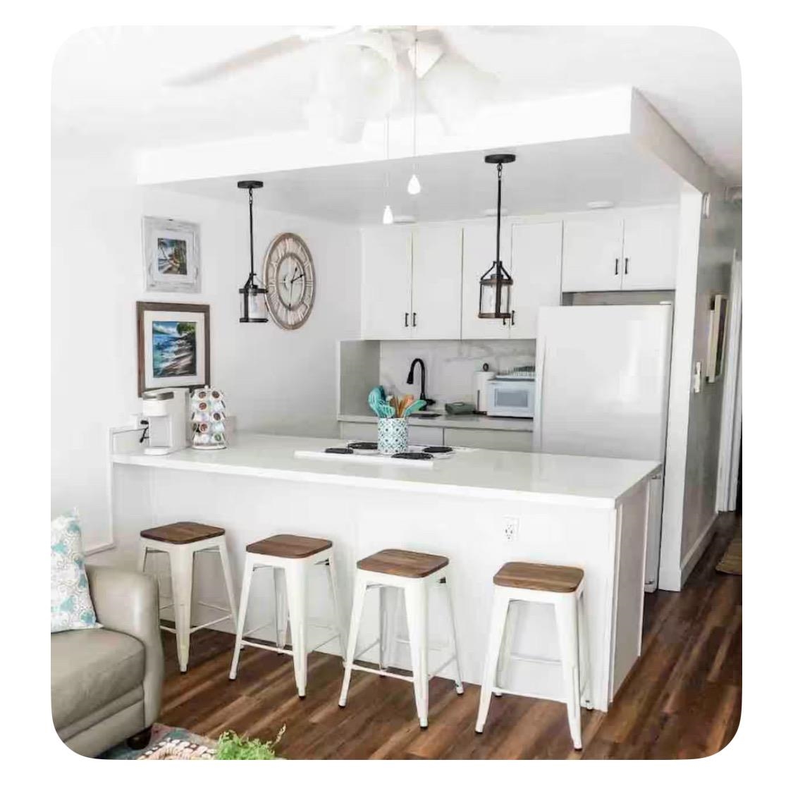 120 Hui Rd F, Unit B5 Lahaina, HI 96761 - Photo 1 of 17 a kitchen with kitchen island granite countertop a table and chairs