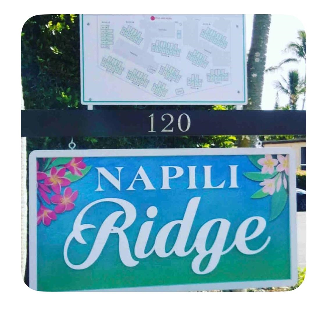 120 Hui Rd F, Unit B5 Lahaina, HI 96761 - Photo 15 of 17 a street sign sitting on a wall