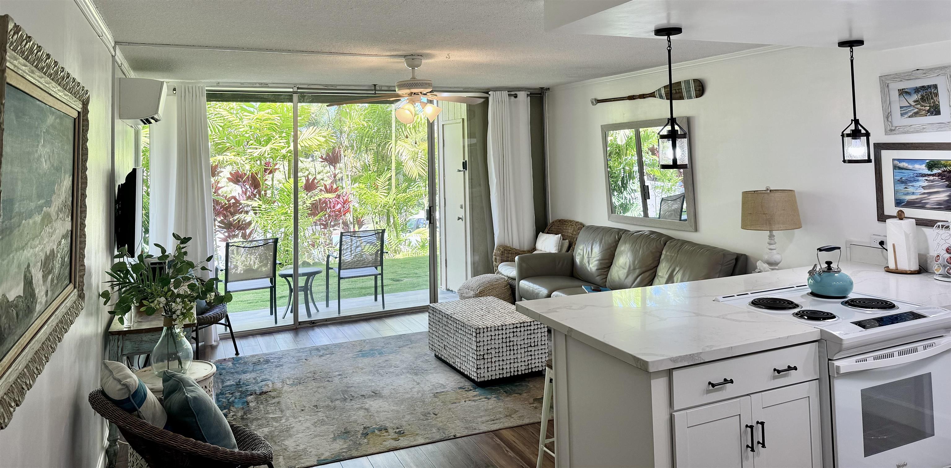 120 Hui Rd F, Unit B5 Lahaina, HI 96761 - Photo 3 of 17 a living room with furniture and a floor to ceiling window