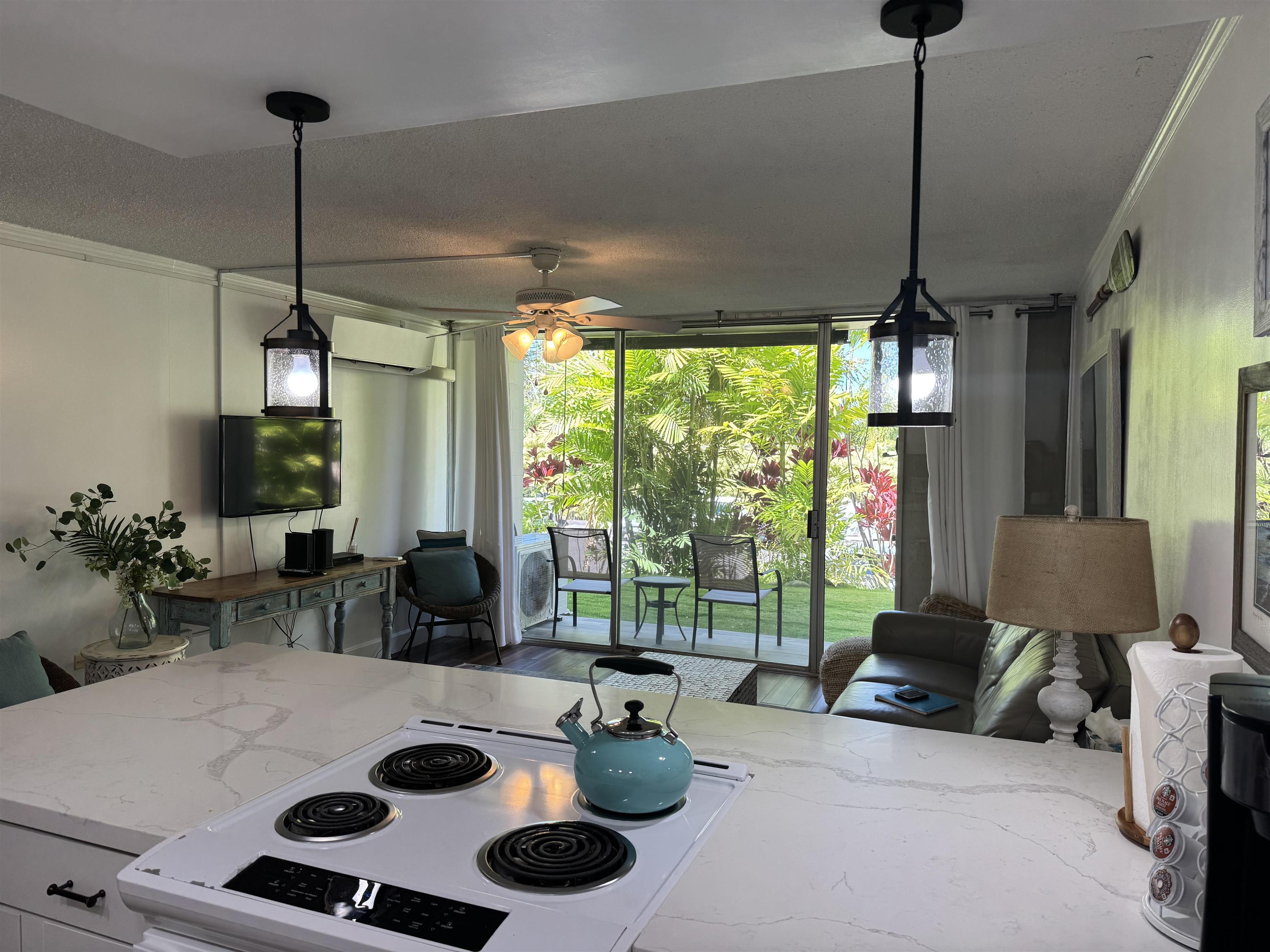 120 Hui Rd F, Unit B5 Lahaina, HI 96761 - Photo 4 of 17 a living room with furniture and a floor to ceiling window