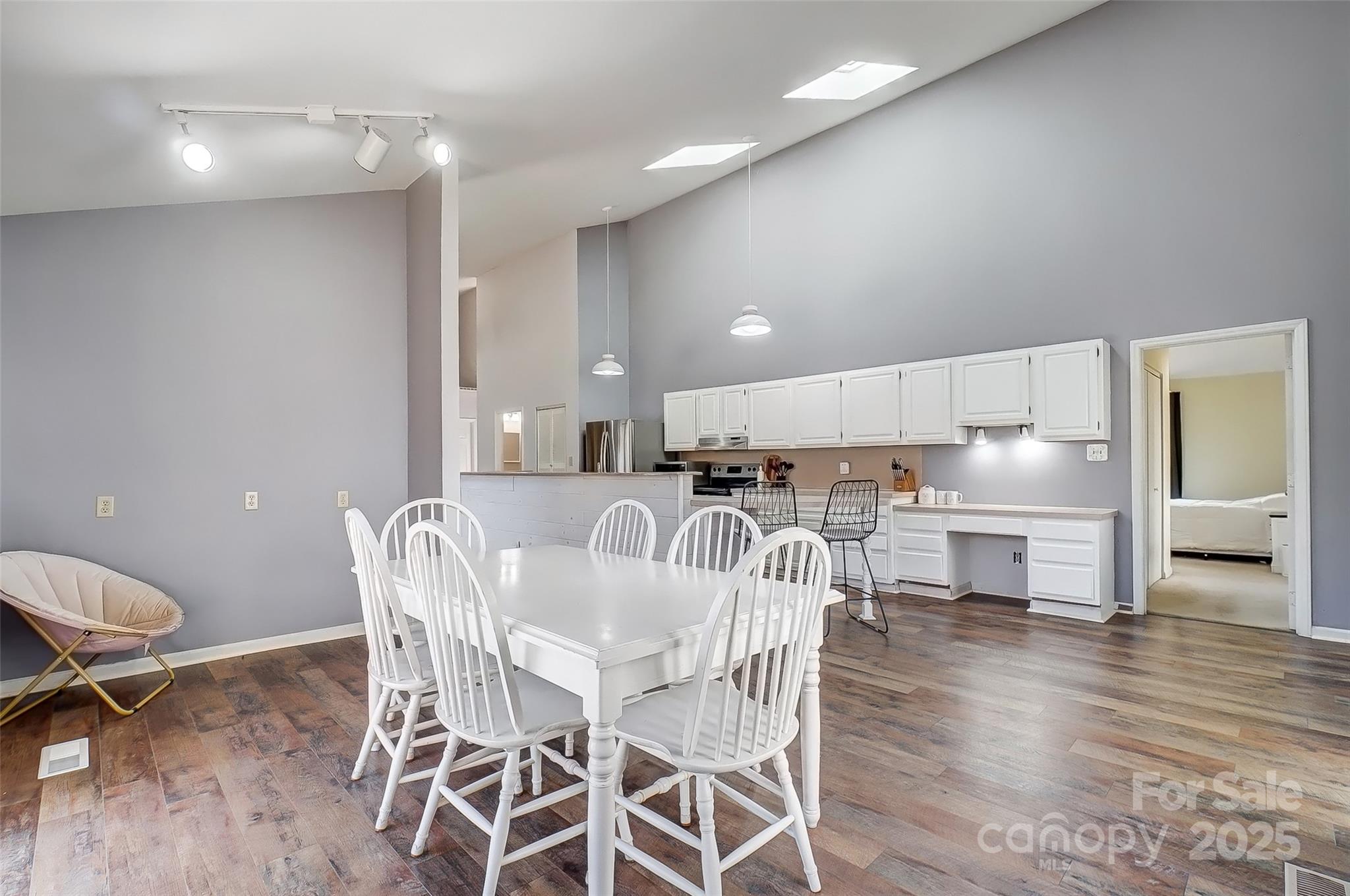 1205 Molokai Drive Tega Cay, SC 29708 - Photo 14 of 33 a kitchen with kitchen island a dining table and chairs