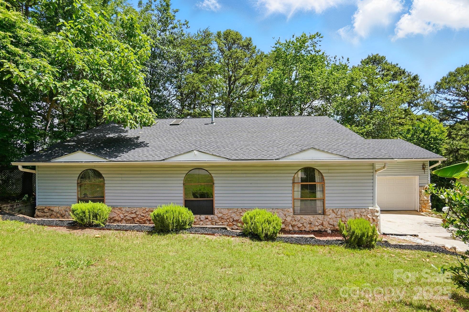 1205 Molokai Drive Tega Cay, SC 29708 - Photo 2 of 33 front view of a house with a yard
