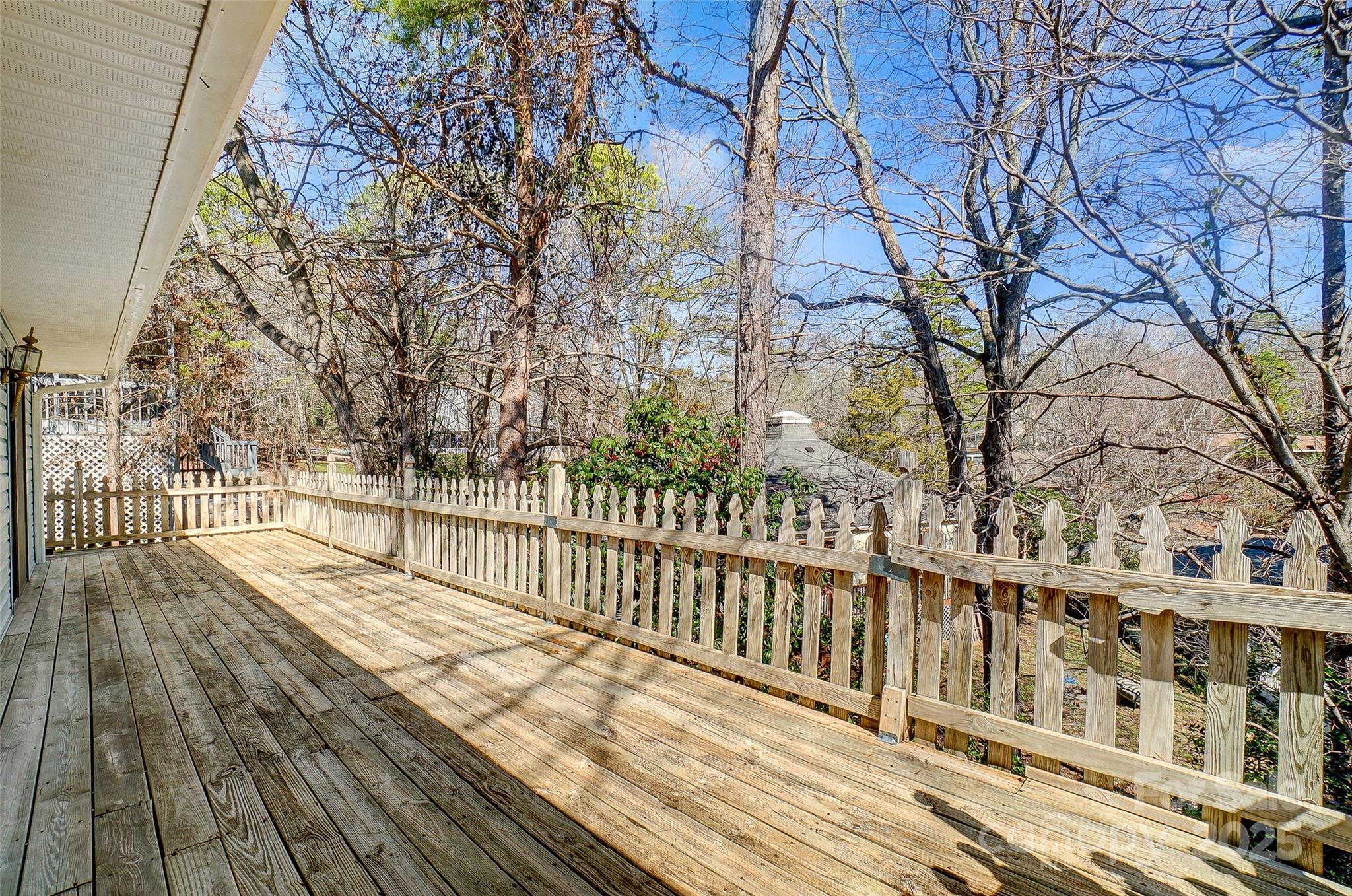 1205 Molokai Drive Tega Cay, SC 29708 - Photo 27 of 33 a view of a balcony with wooden floor and fence