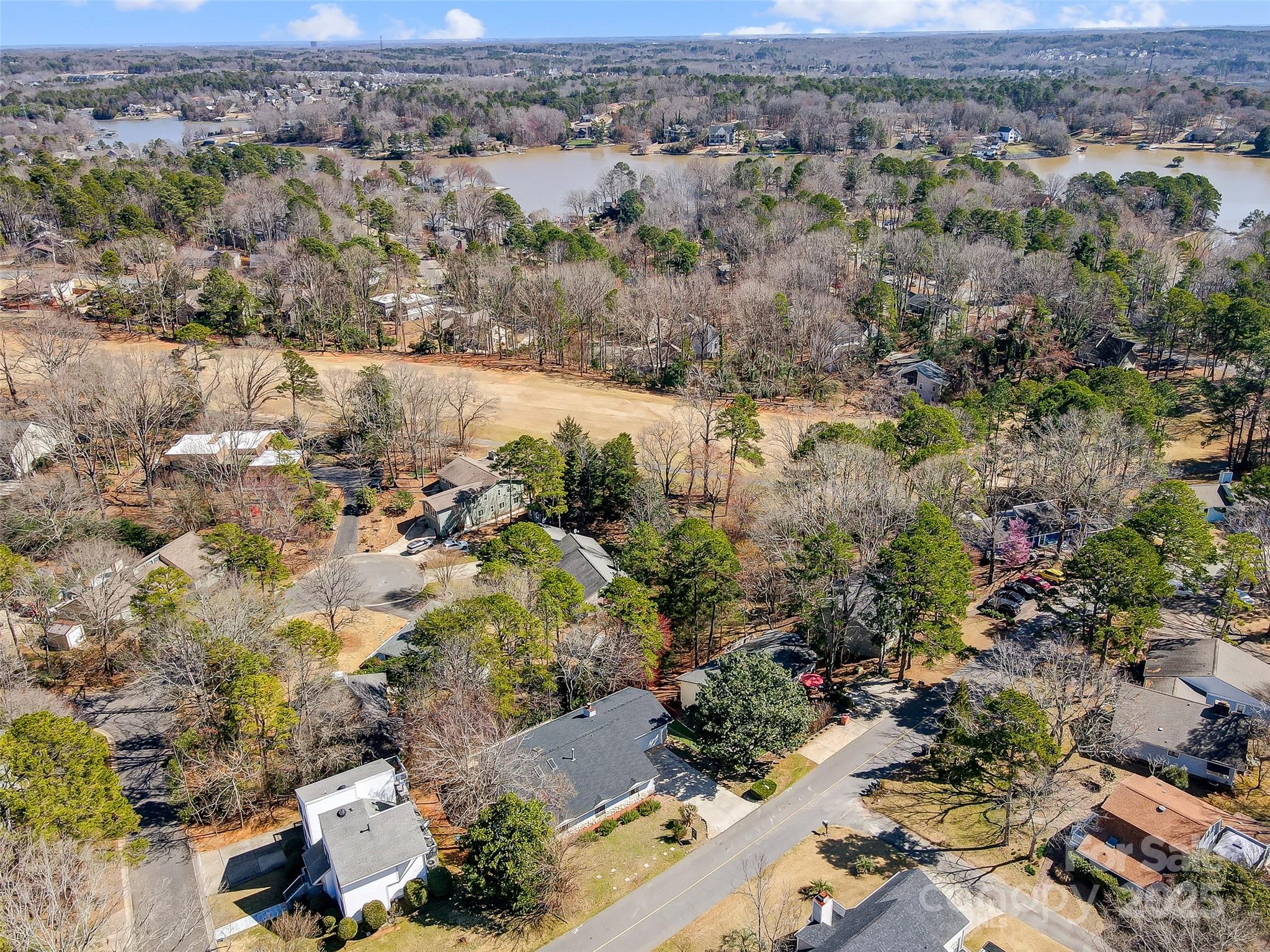 1205 Molokai Drive Tega Cay, SC 29708 - Photo 30 of 33 an aerial view of house with yard and mountain view in back