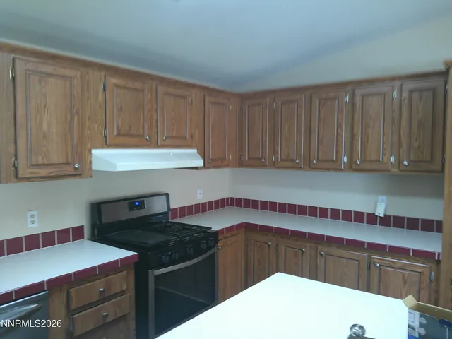 a kitchen with a cabinets and washing machine