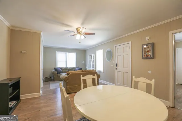 a bathroom with a sink vanity mirror and toilet
