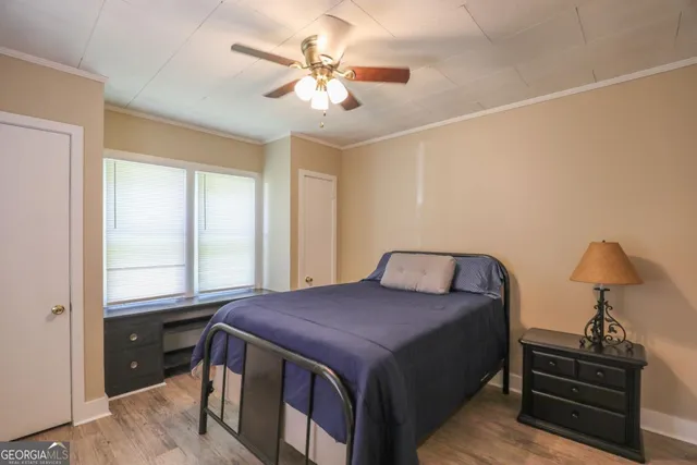 a bedroom with a bed and window