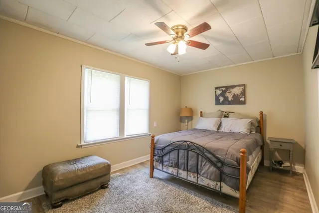 a bedroom with a bed and television